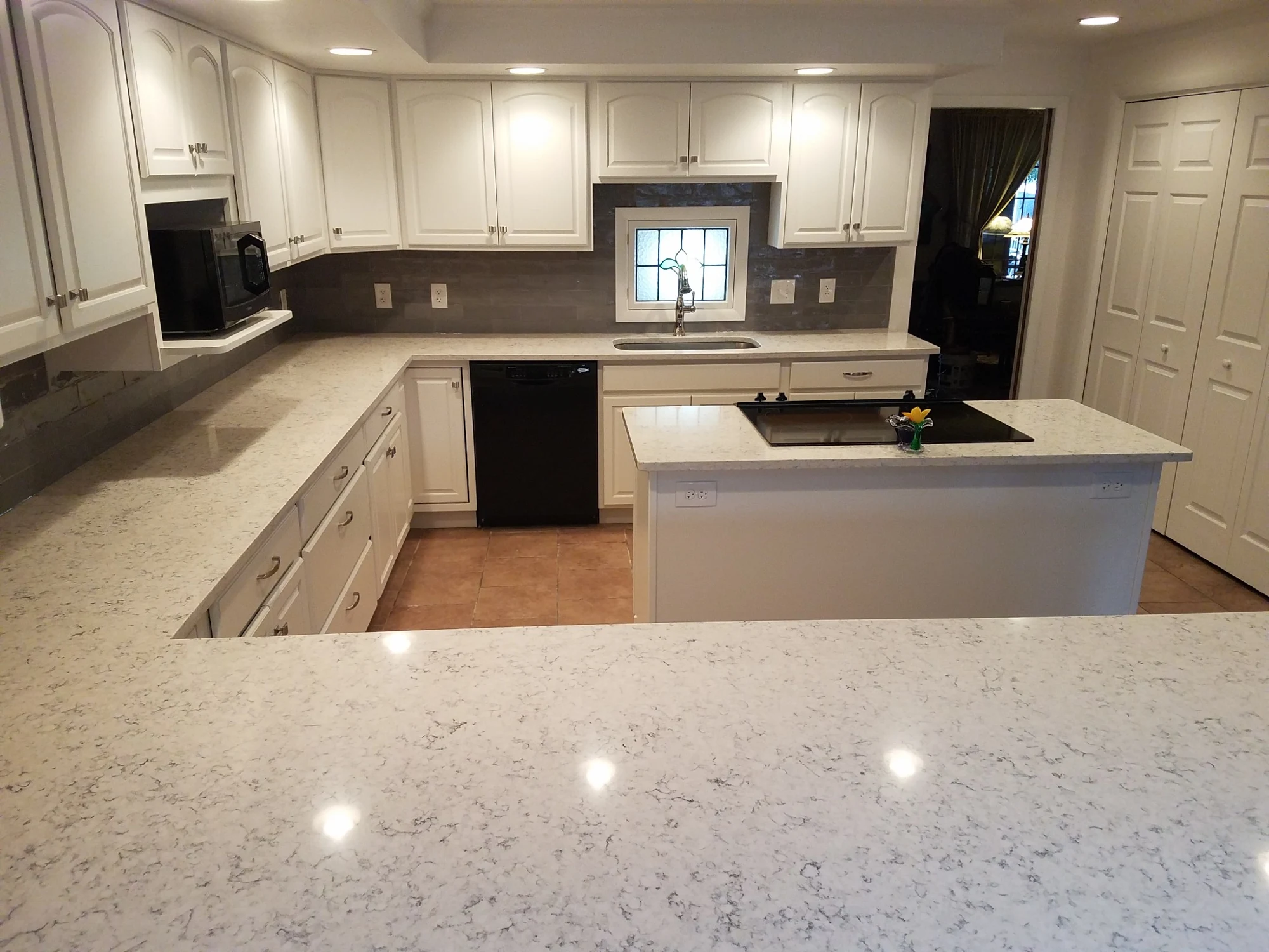 Wide finished view of white kitchen remodel